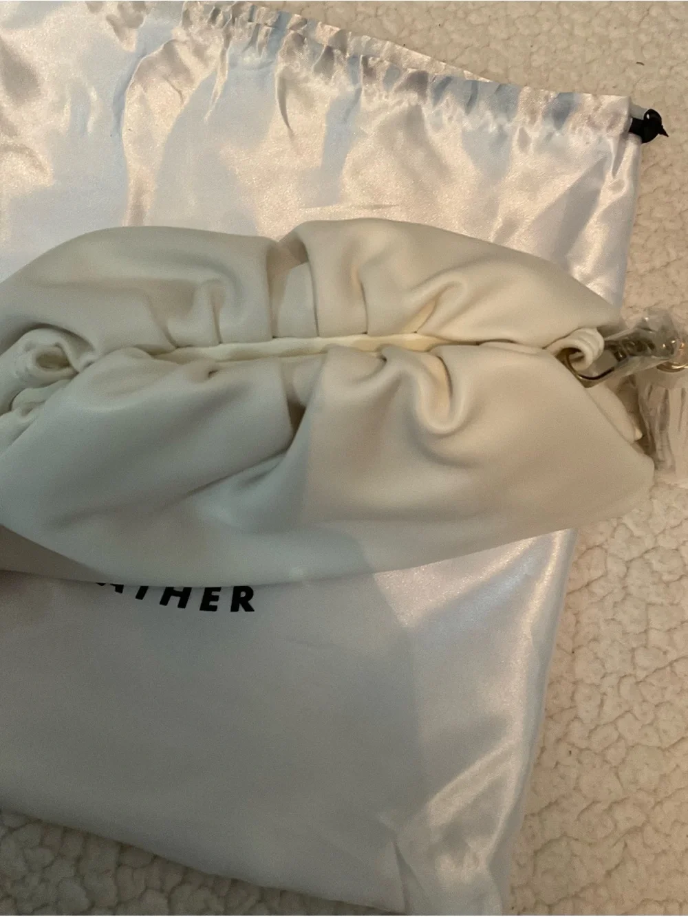 Understated Leather crescent cream
